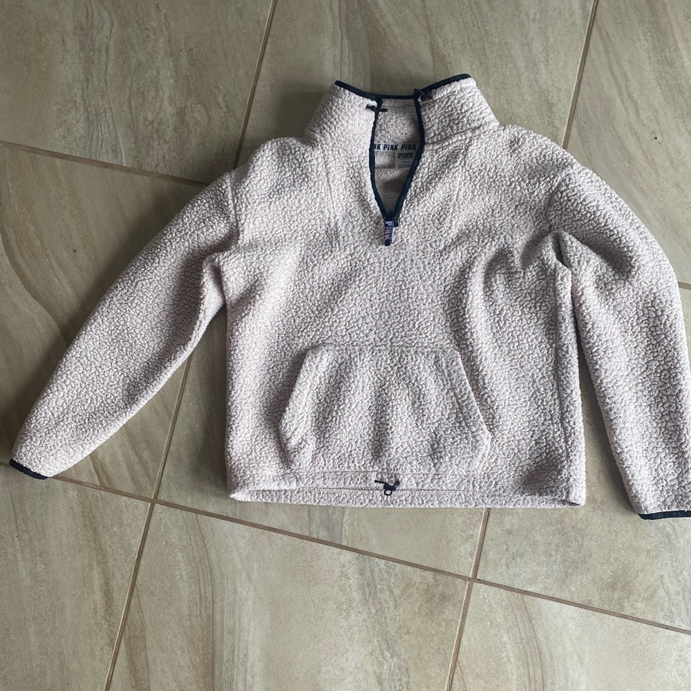 PINK fuzzy sweater.